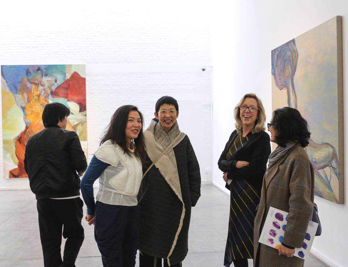 Ms. Meg Maggio (the second from the right) talked with visitors at Pékin Fine Arts.jpg