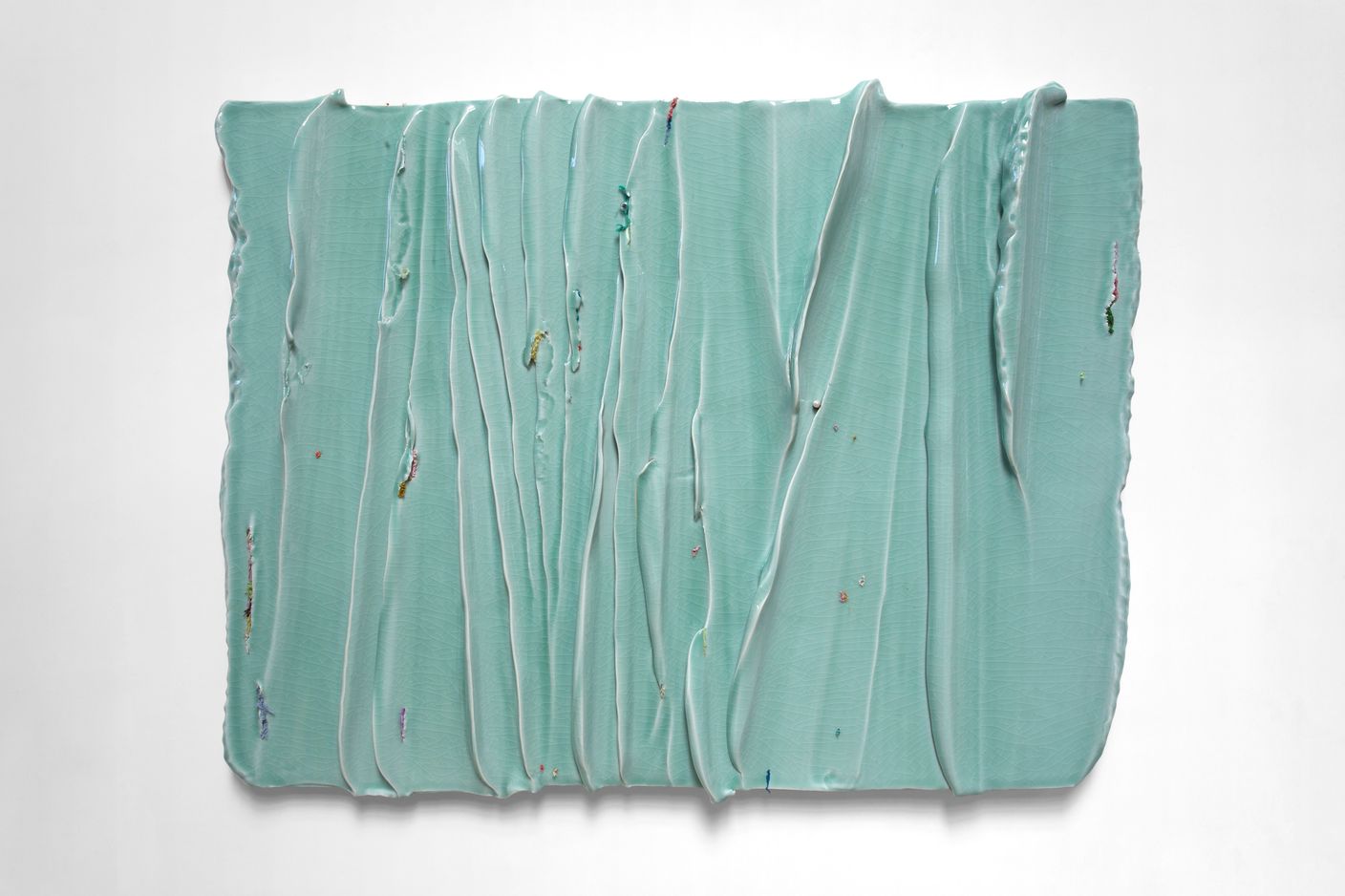 Yin Xiuzhen, Wall Instrument -The Surging Waves Chronicles Vol.3, (2019–2021). Porcelain, used clothes. 98 cm × 122 cm × 10 cm. ? Yin Xiuzhen. Courtesy Pace Gallery..jpeg