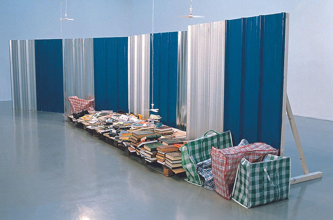 Huang Yongping, Kiosque Flottant, 2000. Sheet metal, bags, the artist's books, arabic books, muyu, small fan (Variable dimensions).png